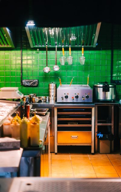 Kitchen table with professional equipment in a public cafe. Kitchen table with professional equipment in a public cafe.